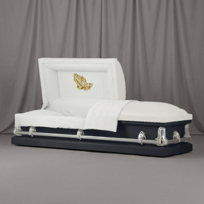 Praying Hands Casket | Artist Selections — White and Charcoal two-tone steel casket with silver hardware and embroidered Praying Hands head panel